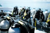 Close-up of underwater diving equipments on boat.