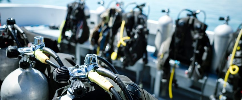 Close-up of underwater diving equipments on boat.